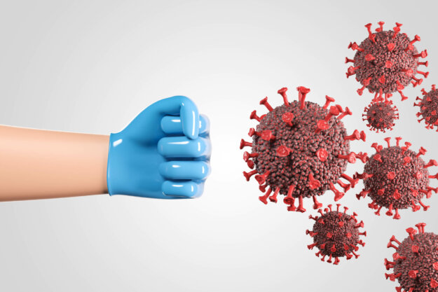Medical worker in blue glove fighting against new 2019-ncov coronavirus cells over white background. Concept on planet pandemic control.