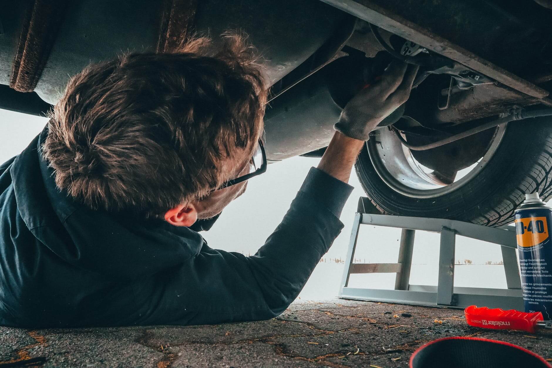 pexels-photo-2244746 man fixing vehicle engine